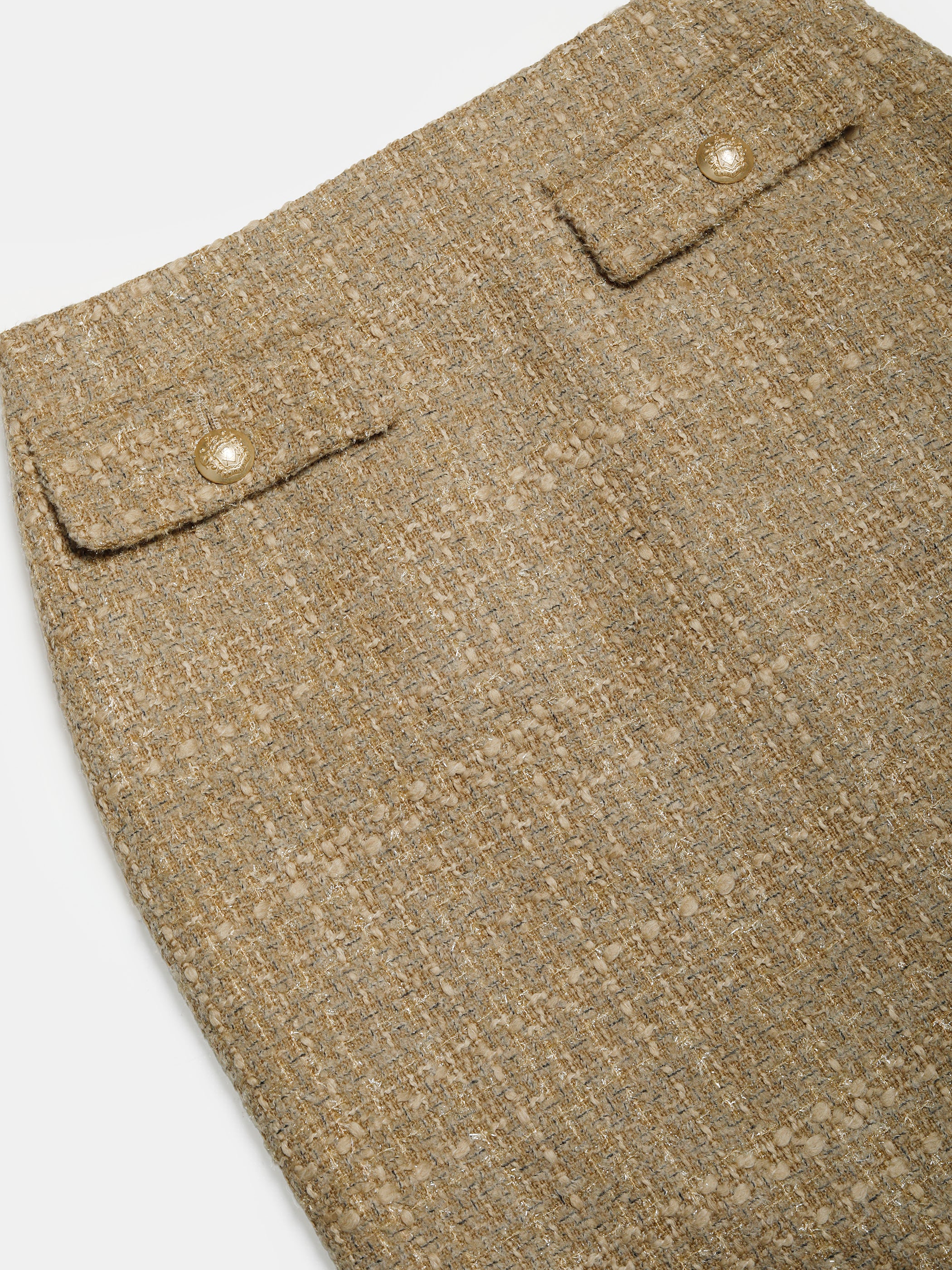 Bukleehameen läppätaskun nappi ja kohokuvioitu beige bukleekangas